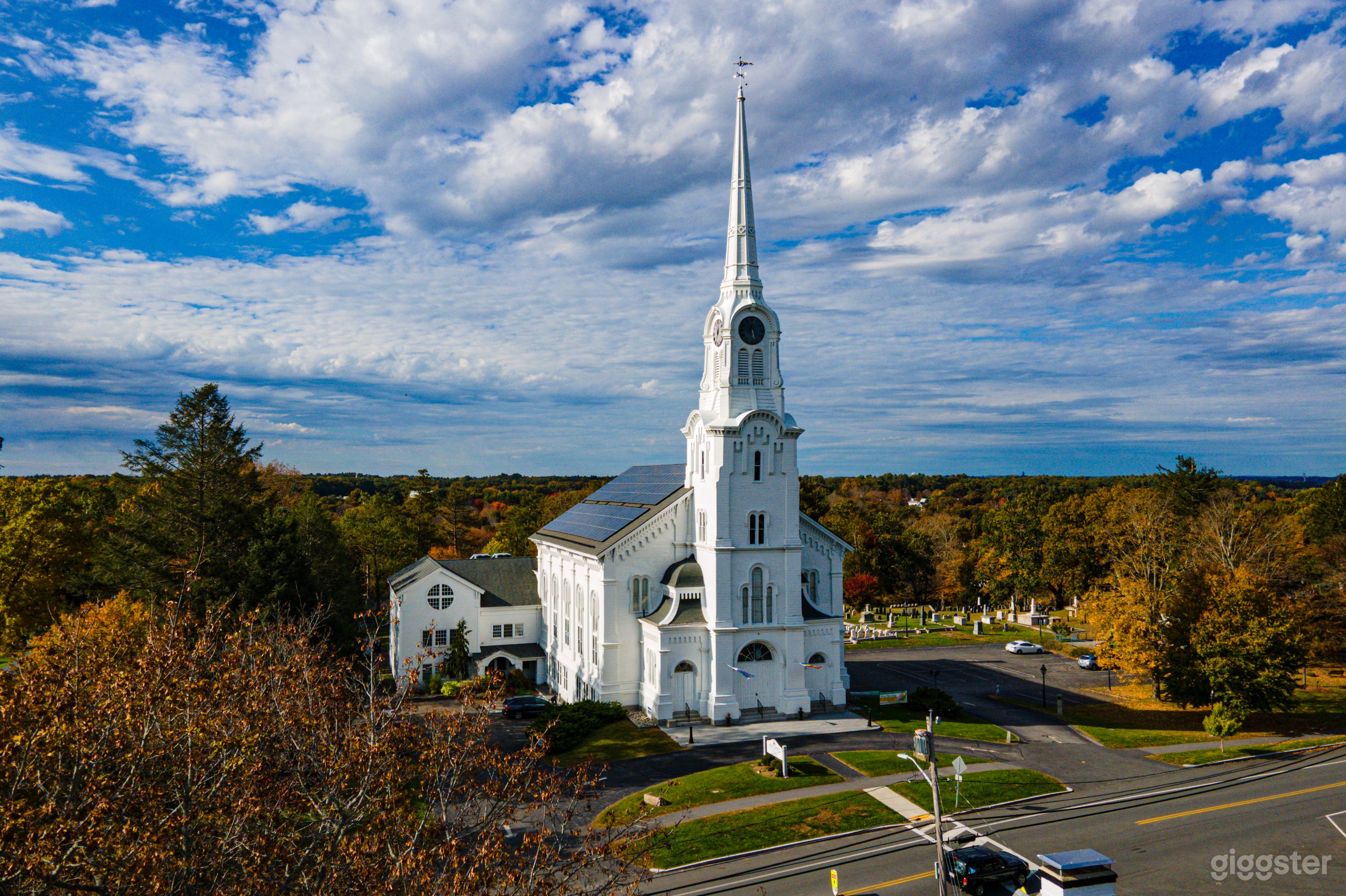 A traditional tall, white steepled New England church, a Romanesque Revival, built in 1860 