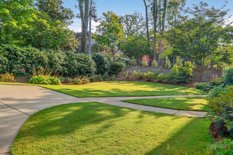 Spacious front yard with lush landscaping and greenery 