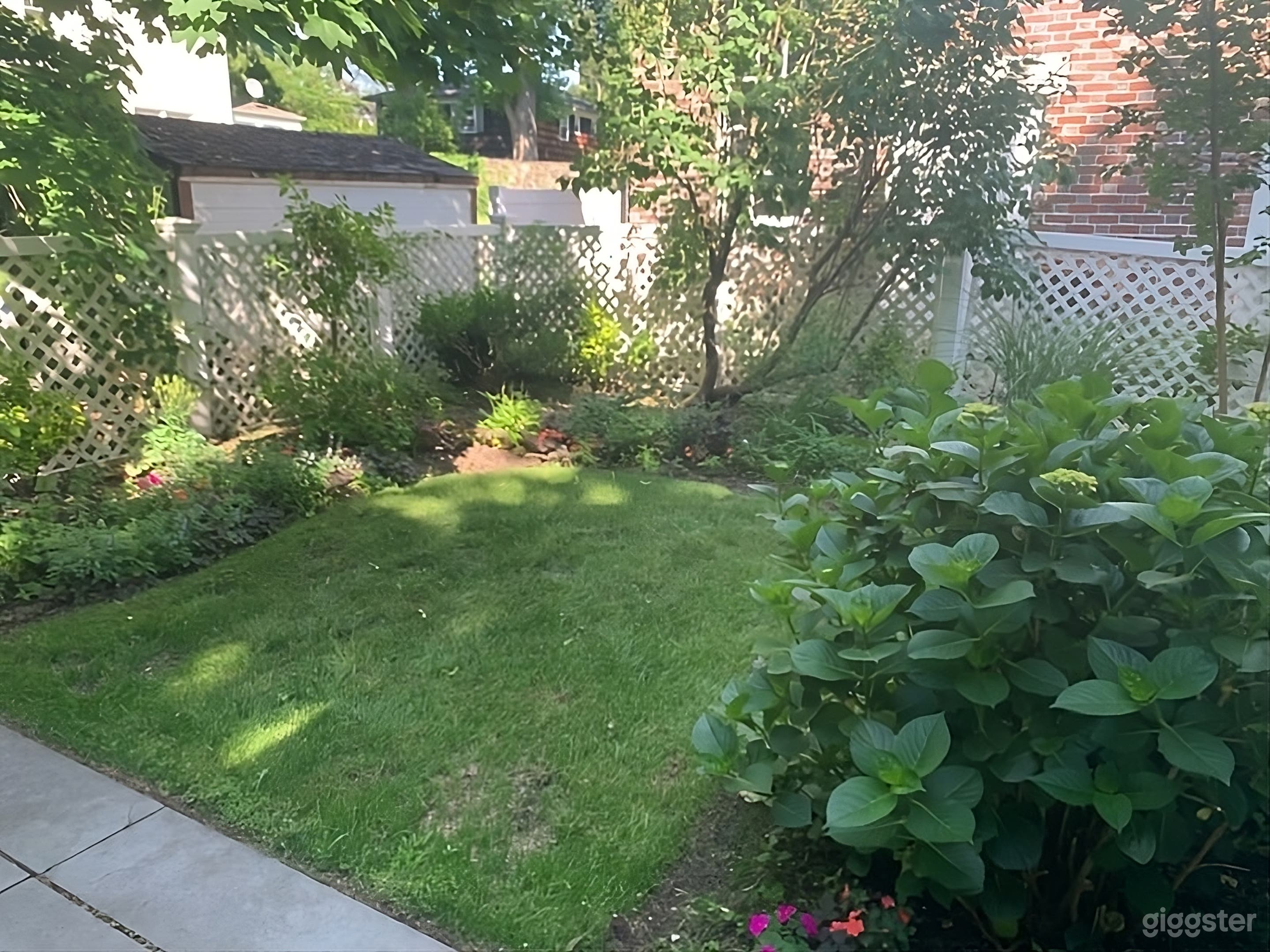 Lush Fenced Backyard Photo 4