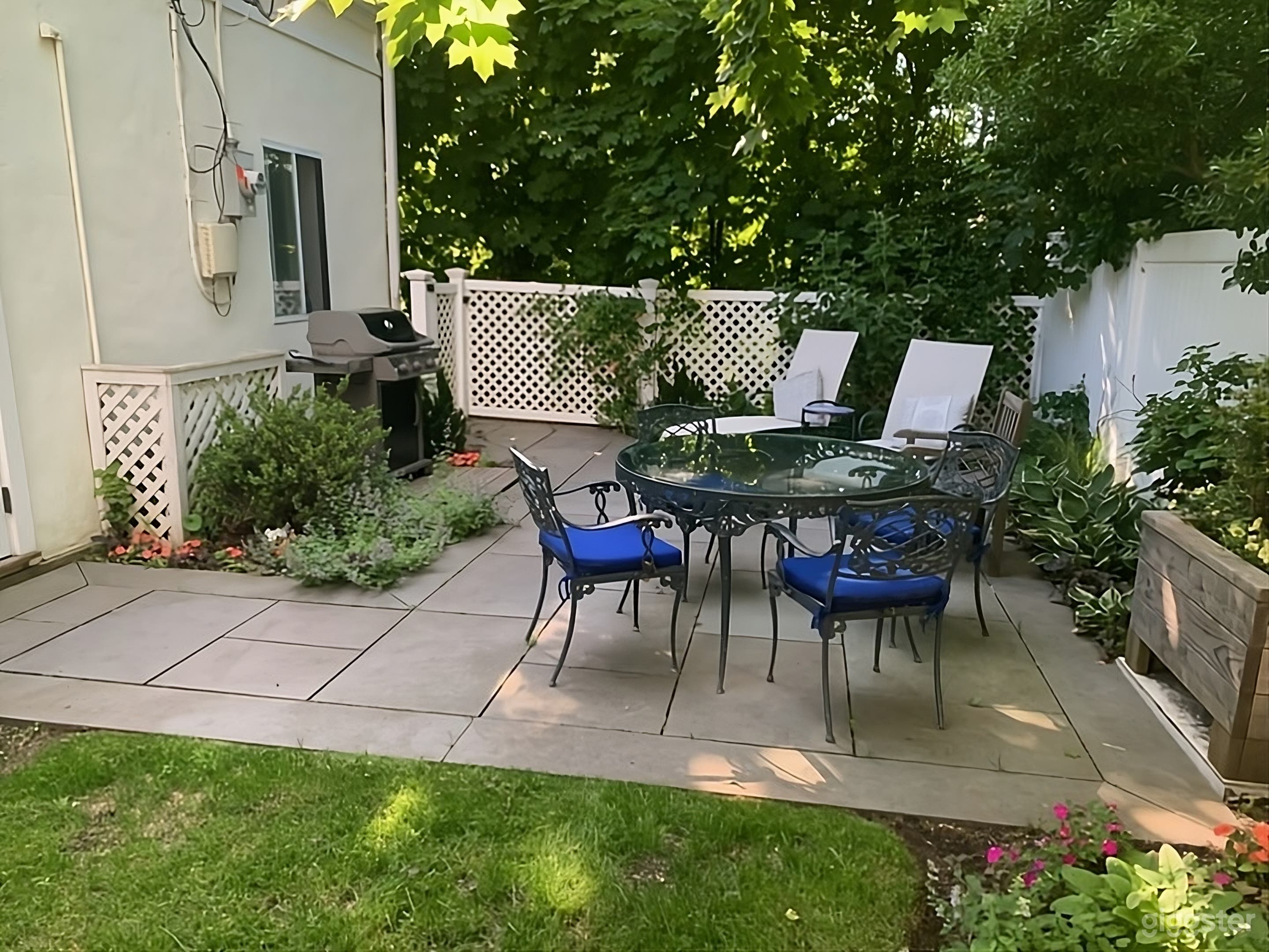 Lush Fenced Backyard Photo 1