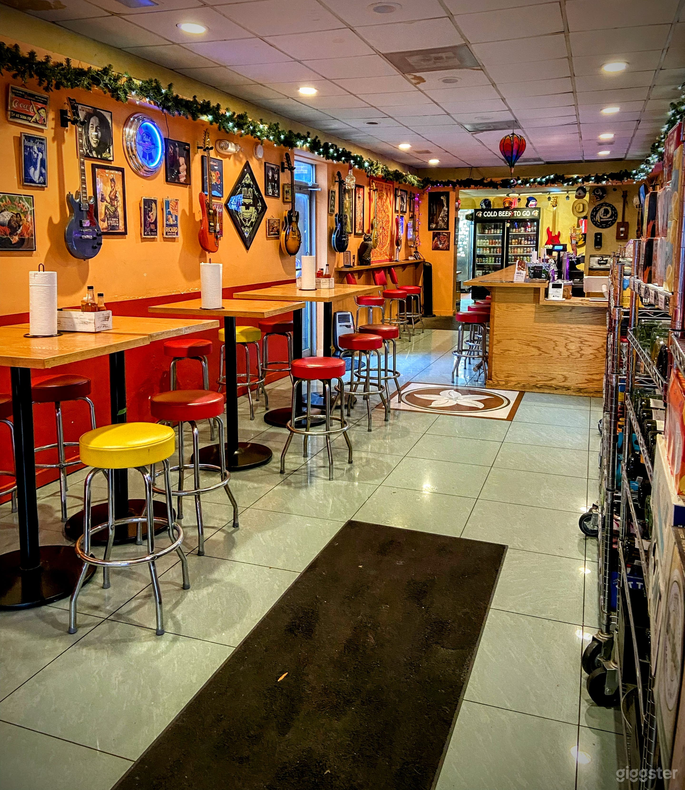 Natural wood bar and tables with tile floor.