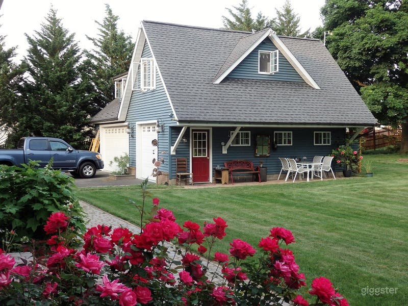 View of detached garage/ Carriage House in the spring