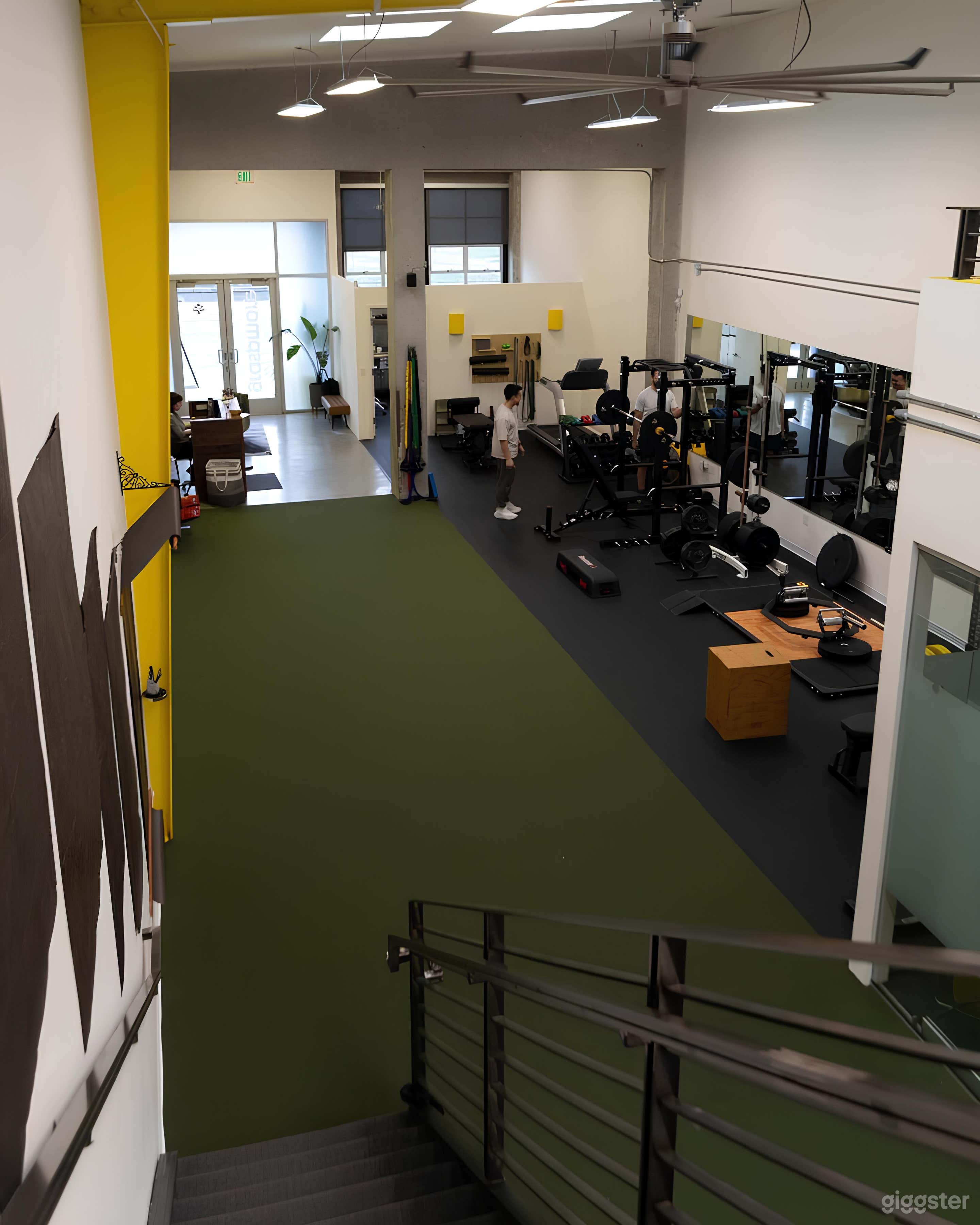 Spacious Industrial Loft Boutique Gym with Natural Light Photo 3