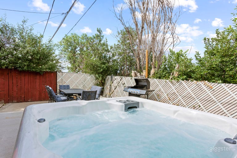  Backyard Bliss Unveiled!  - Step into relaxation and culinary delights with a hot tub and grill area in your backyard. 