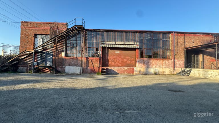  Industrial Red Brick Exterior Gated Parking Lot 