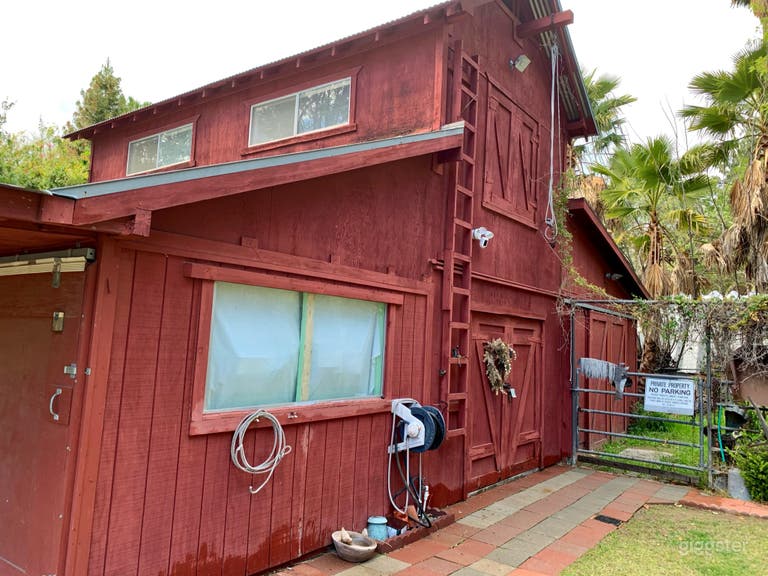  Main entrance faces east. 
Double door hay loft.

 