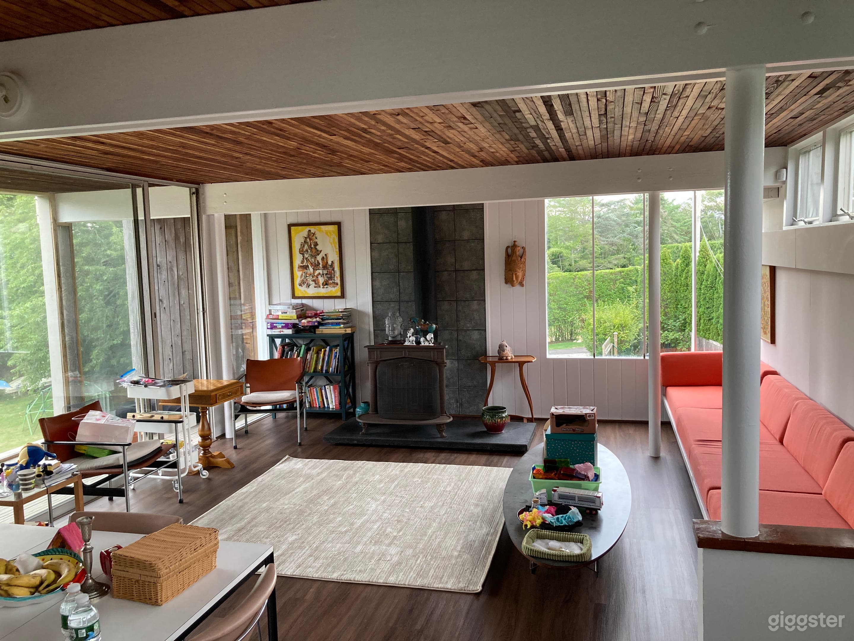 Exposed steel and beams, wood paneled ceiling
