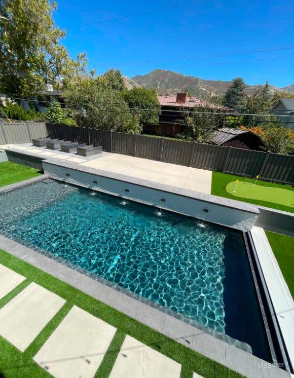 Flexible Backyard rental with Pool and Green Turf Photo 4