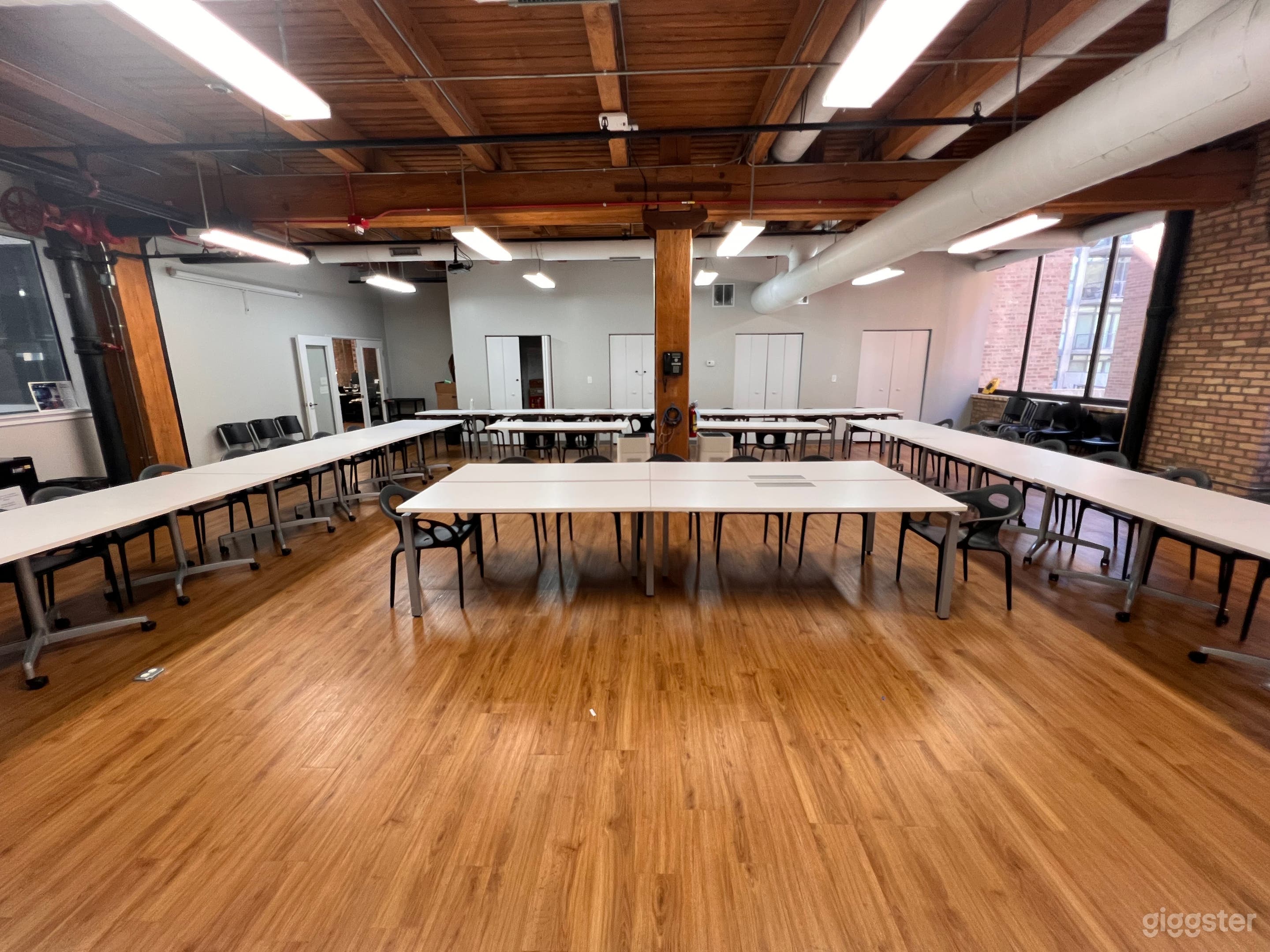 Large Conference Room with high exposed ceilings and large windows