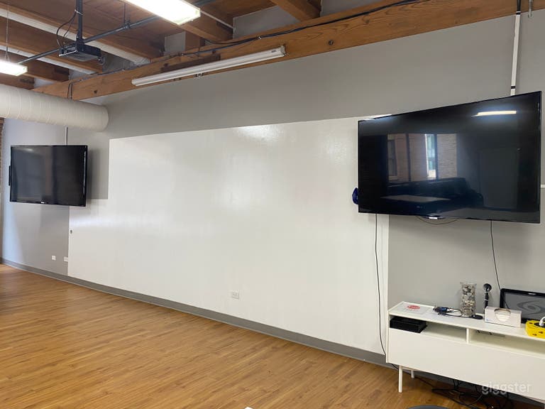  The north wall in the Large Conference Room is a dry-erase wall and has two mounted 70&quot; TVs 
