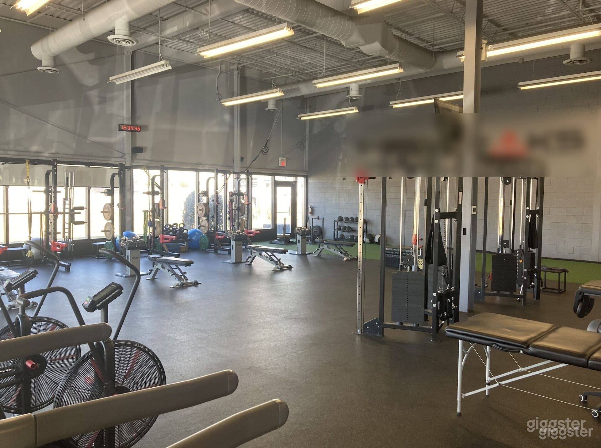 Open concept fitness facility Photo 1