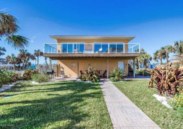 Relaxing Outdoor Pool and Garden at Ormond Beach Photo 3