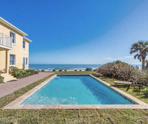 Relaxing Outdoor Pool and Garden at Ormond Beach Photo 1