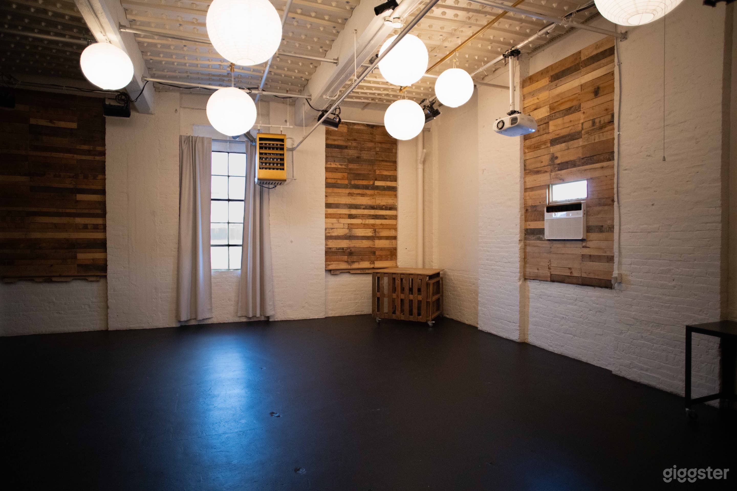 Main Studio: White walls and wood panel walls