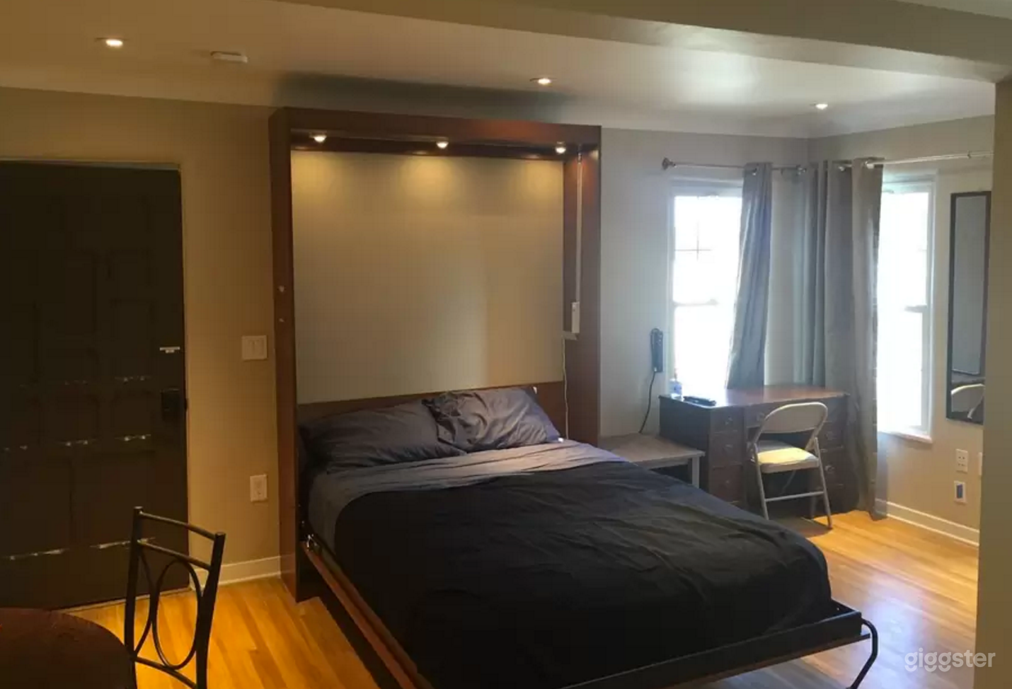 Queen Sized Murphy Bed with LEDs in place and thick, room darkening curtains.