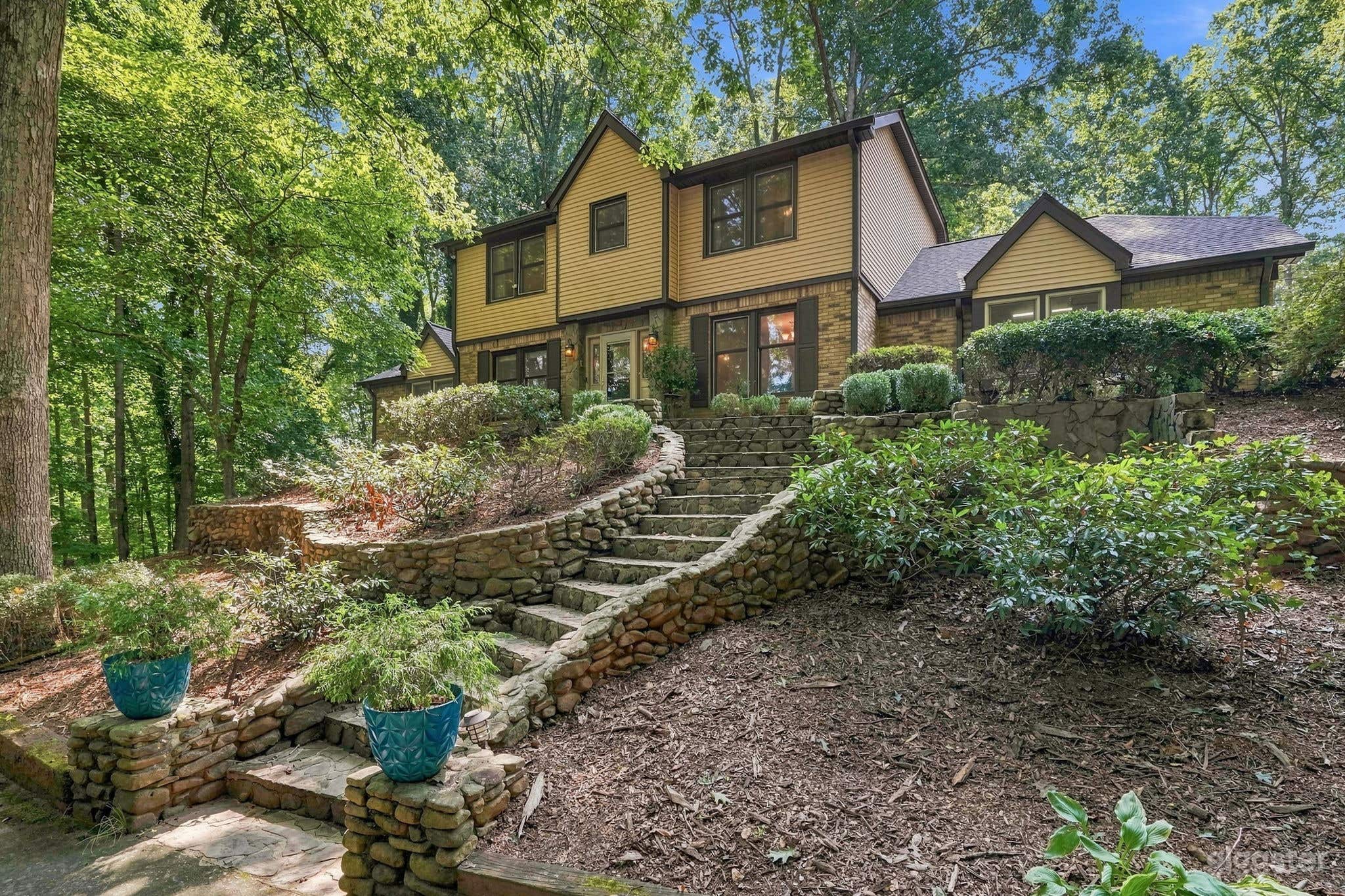 Wooded Estate with Red Barn, Pool, Creek & Acreage Photo 3