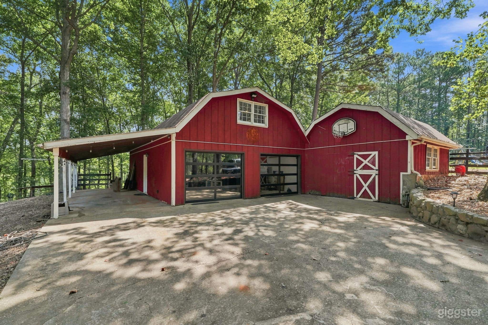 Wooded Estate with Red Barn, Pool, Creek & Acreage Photo 1