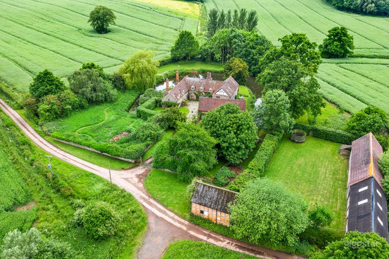  Aerial photo showing entire property; farmhouse and barn. 
