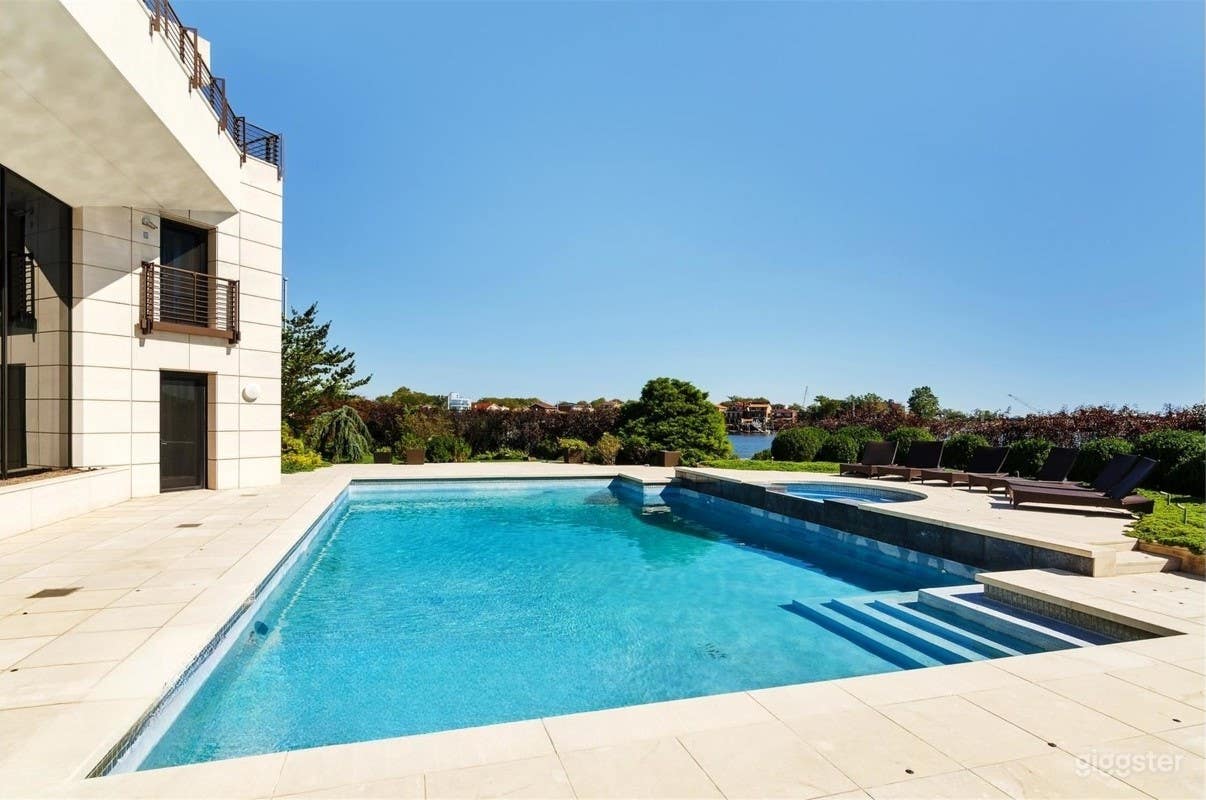 Serene Waterfront Pool Retreat with Spa Photo 2