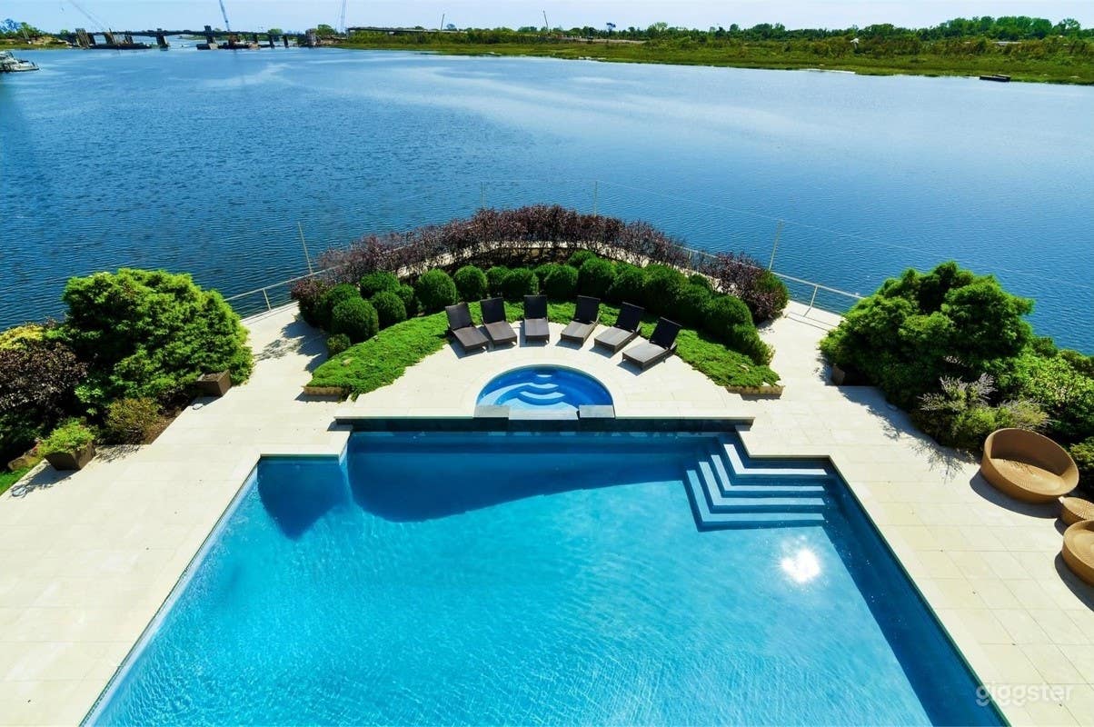 Serene Waterfront Pool Retreat with Spa Photo 1