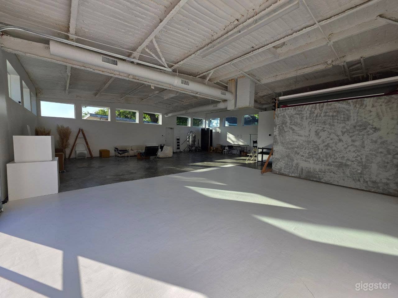 Natural Light Garage with White Canvas Studio Photo 2