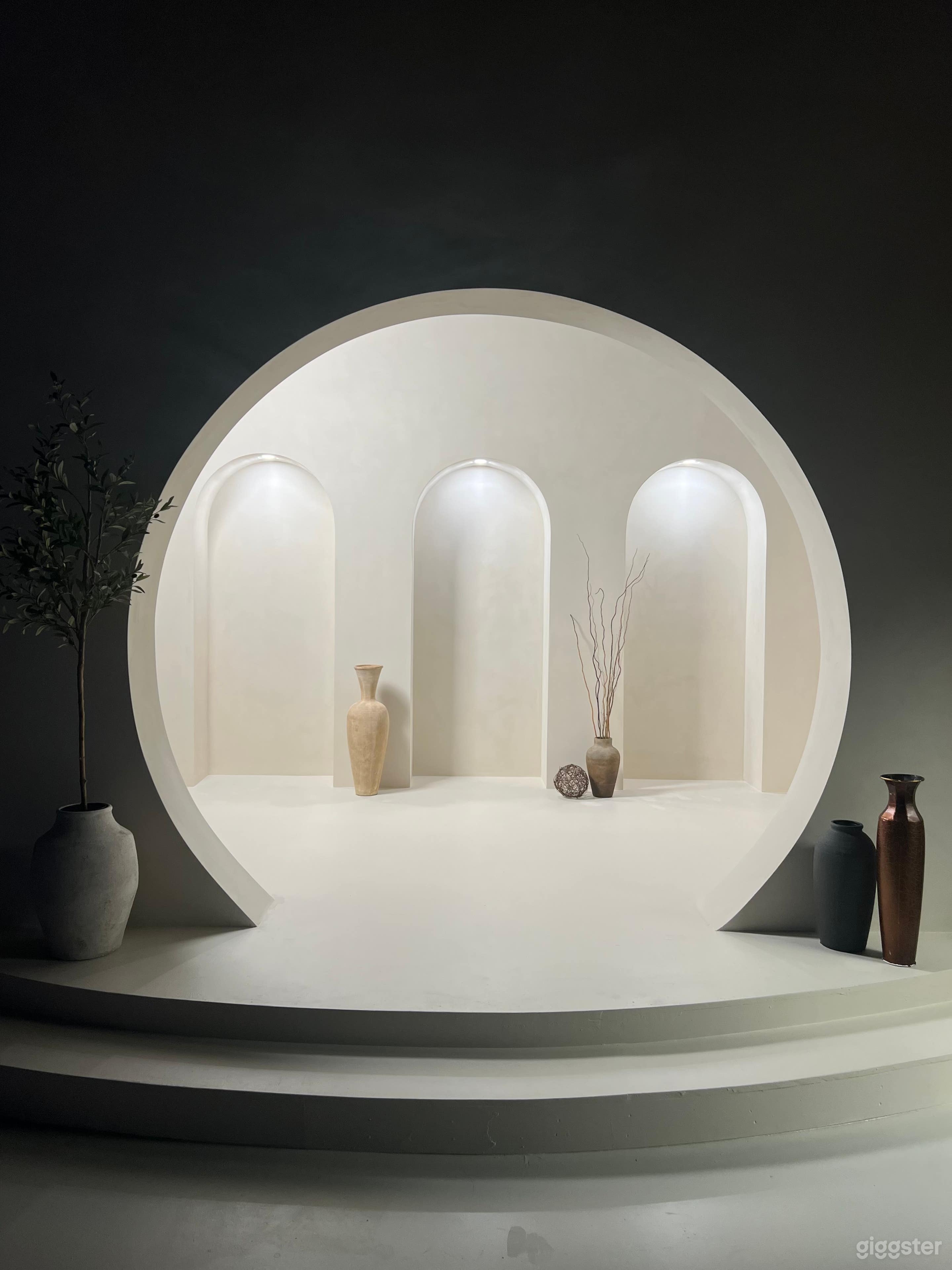 This part of our stage set has a circular walkway entrance that leads into a room with three more arches embedded into the 14 ft wall. Gimbal rgb lights are placed on top of each arch to be able to provide light and color control.