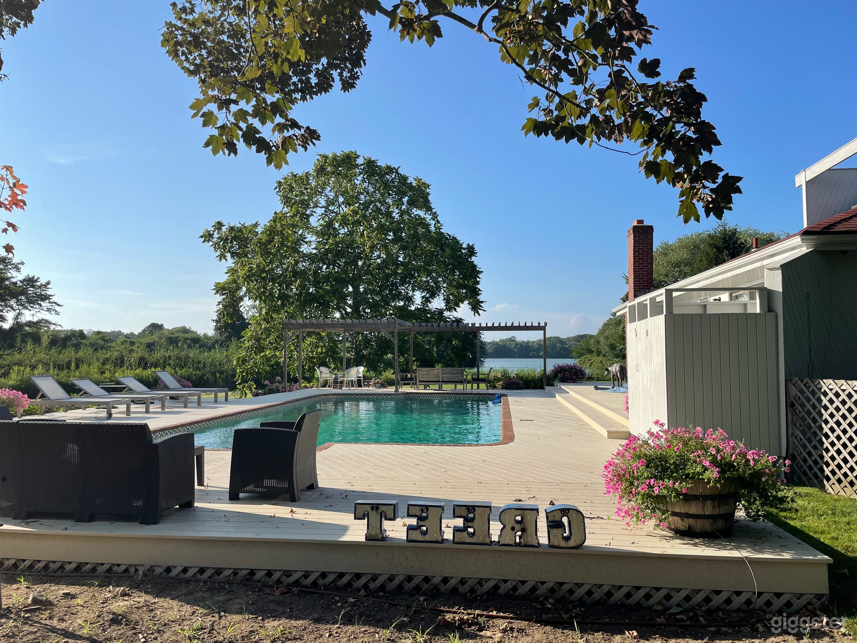 Our Watermill home has over 3 acres of beautiful manicured land. A gunite  pool with gorgeous Spanish tile accents. Surrounded by brick which match the fire place. Outdoor shower and plenty of places to sun on our deck.
Lots of privacy here