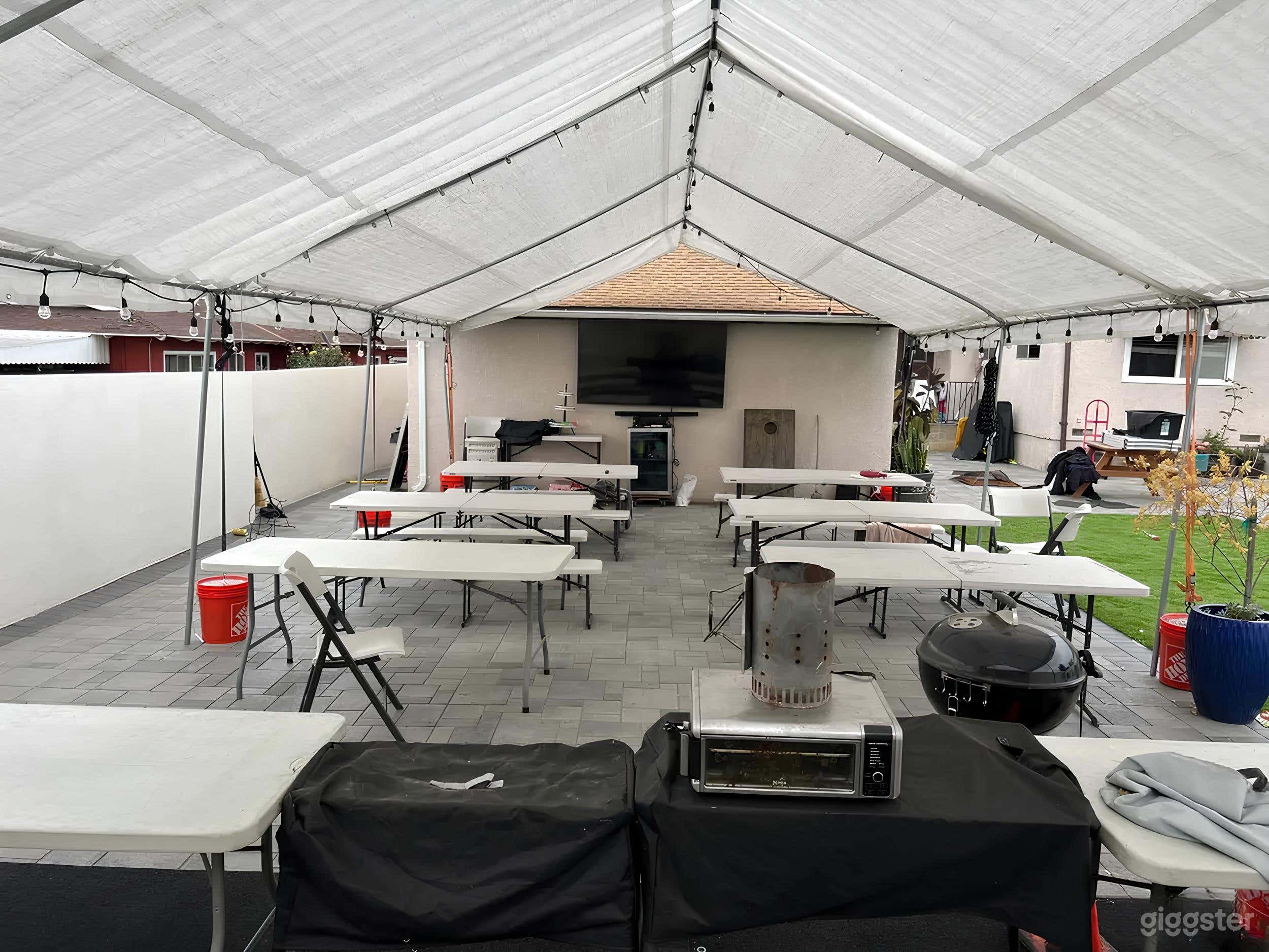 Stylish Pool Lounge with Fire Pit and Covered Seat Photo 4