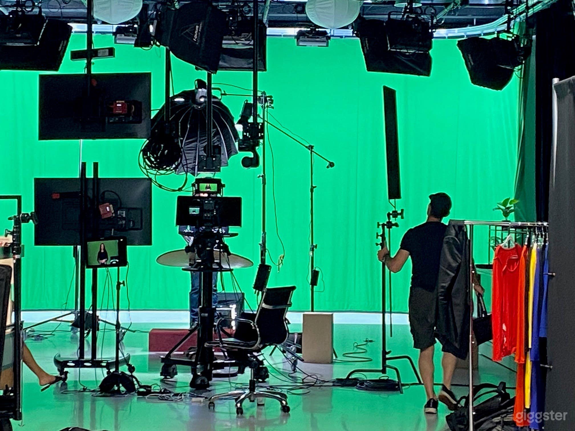 Interview setup with green screen lit cyclorama
