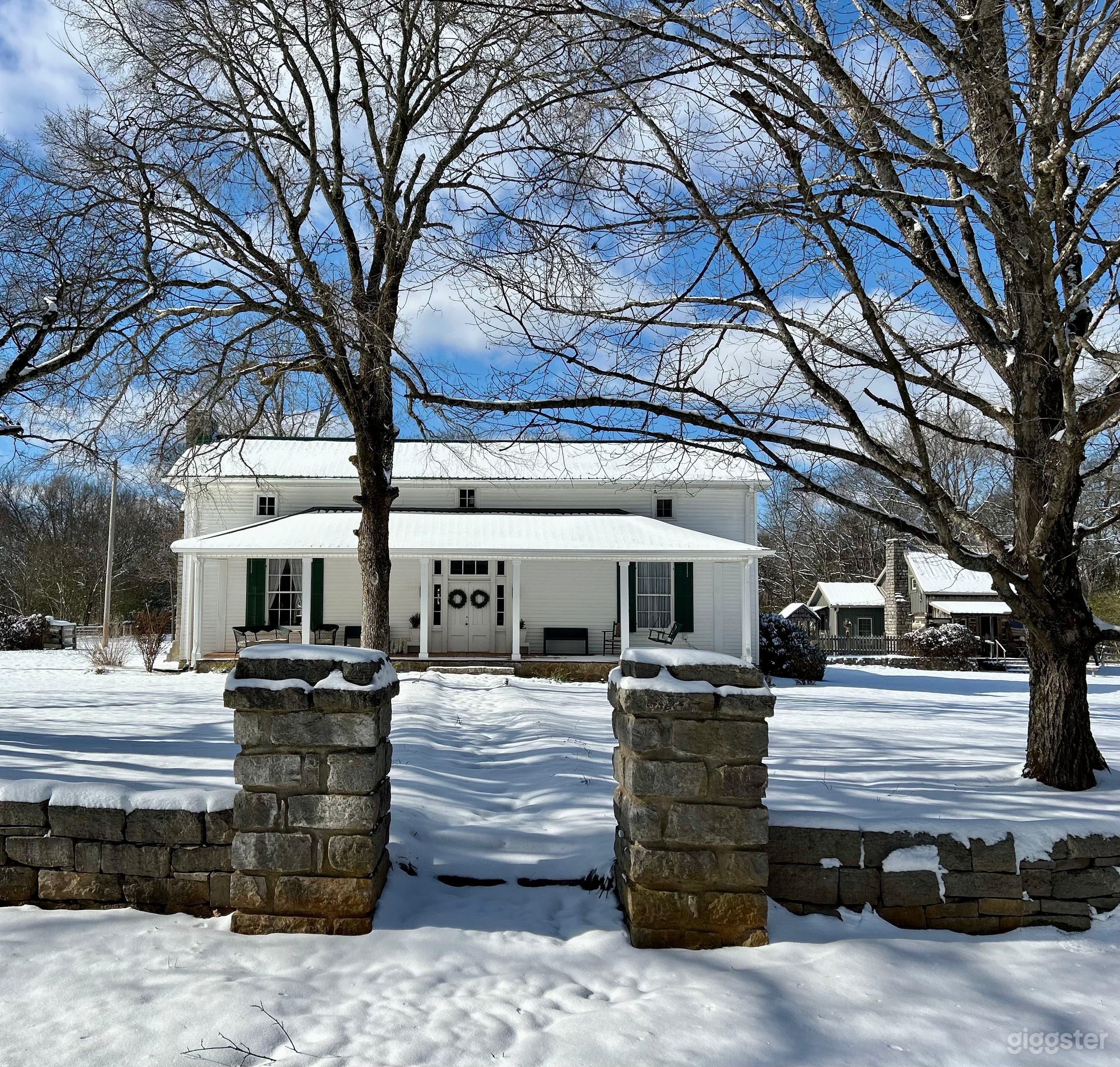 Farmhouse and cabin in winter 