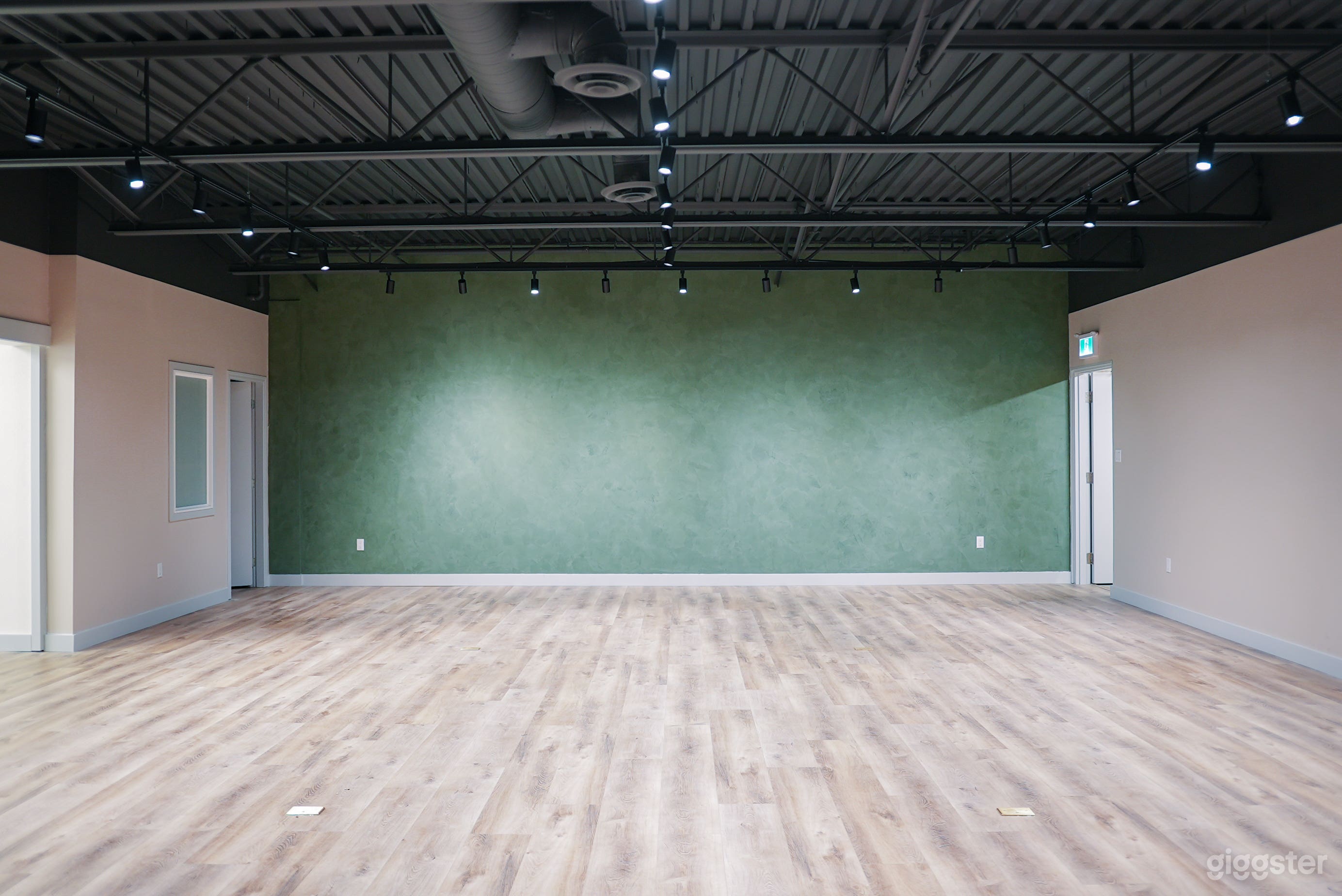 Open-Concept Warehouse Studio in Burnaby with Track Lighting Photo 1