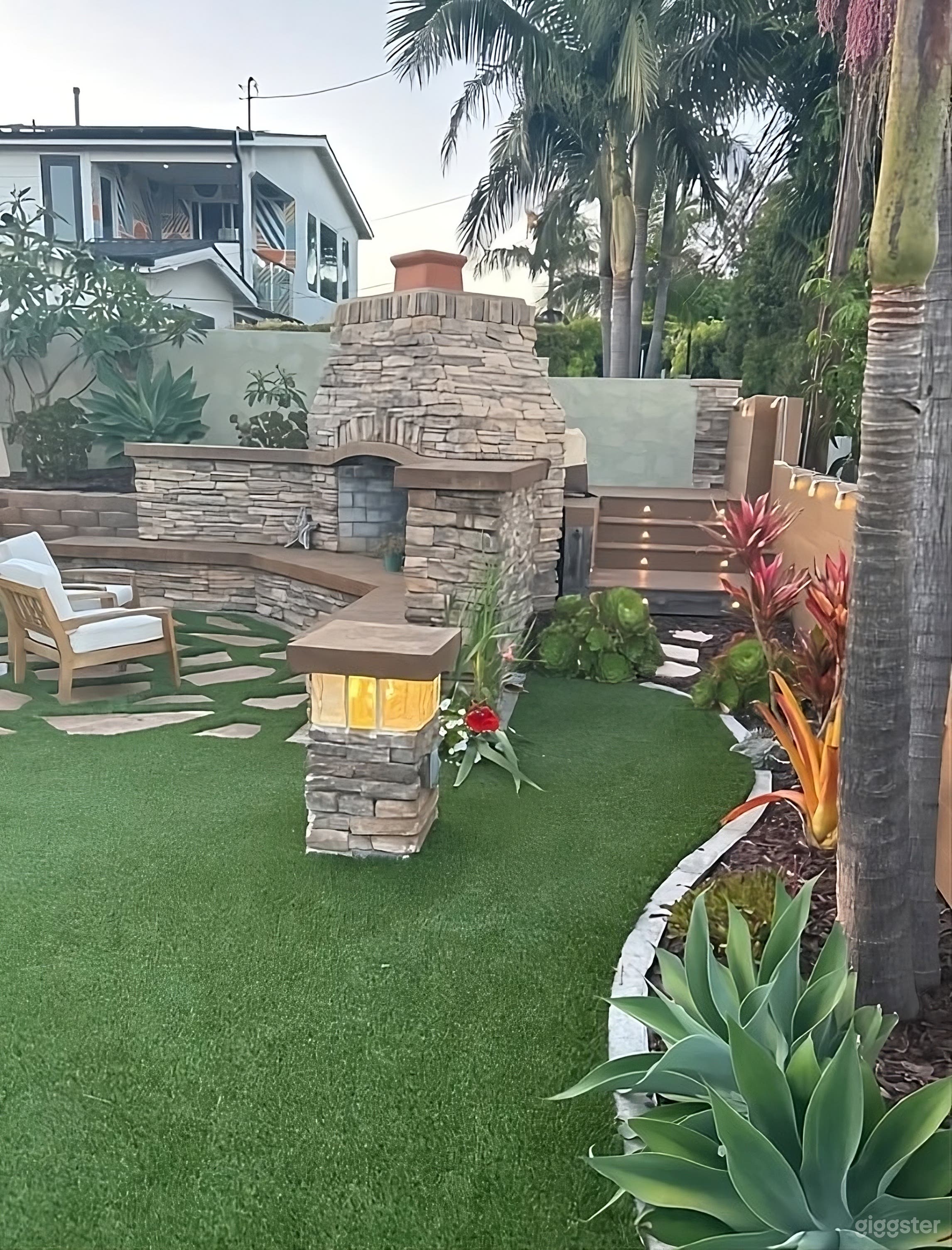Backyard with Covered Patio and Fireplace Photo 2