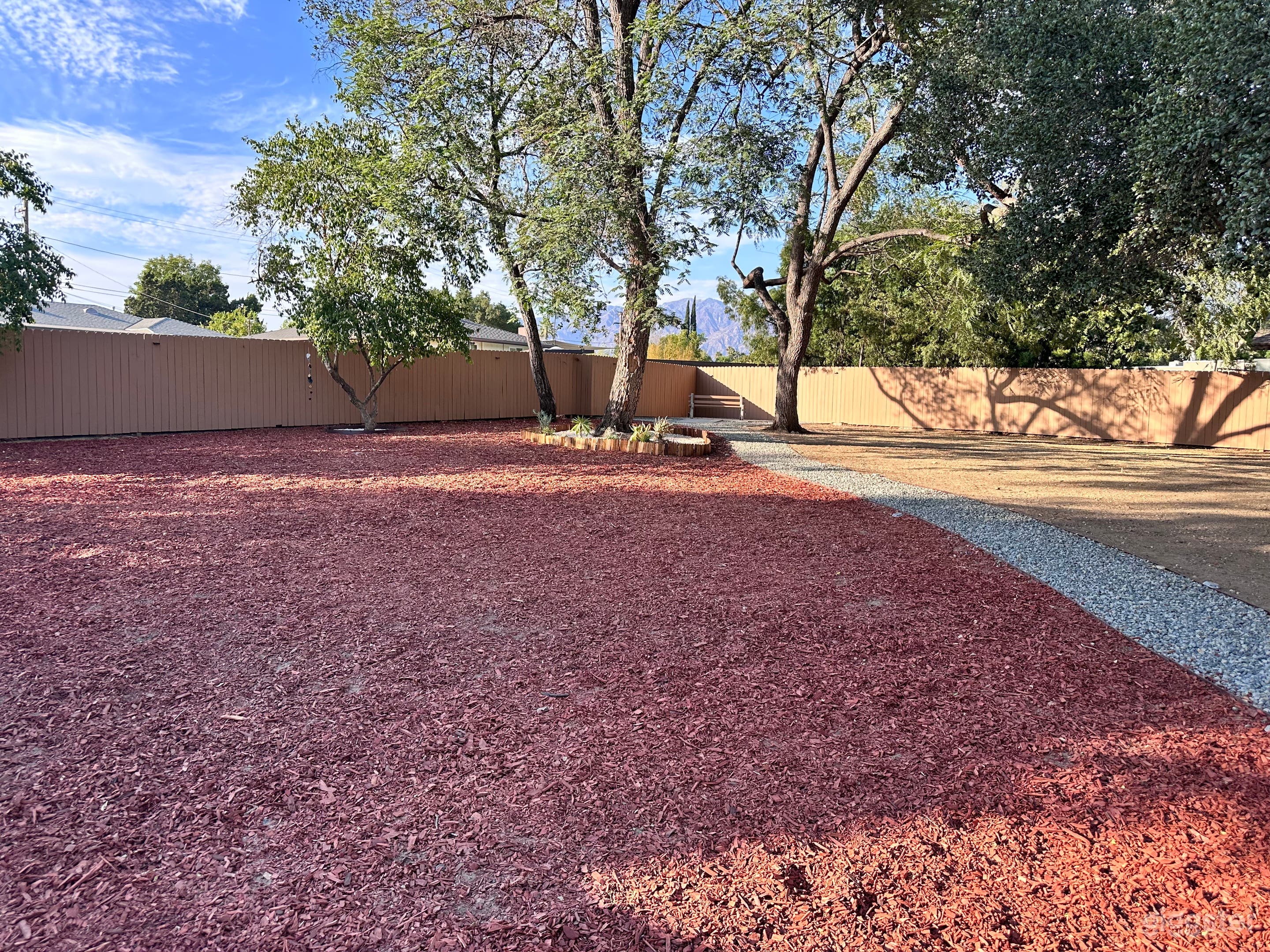 Red mulch covering about half of the space