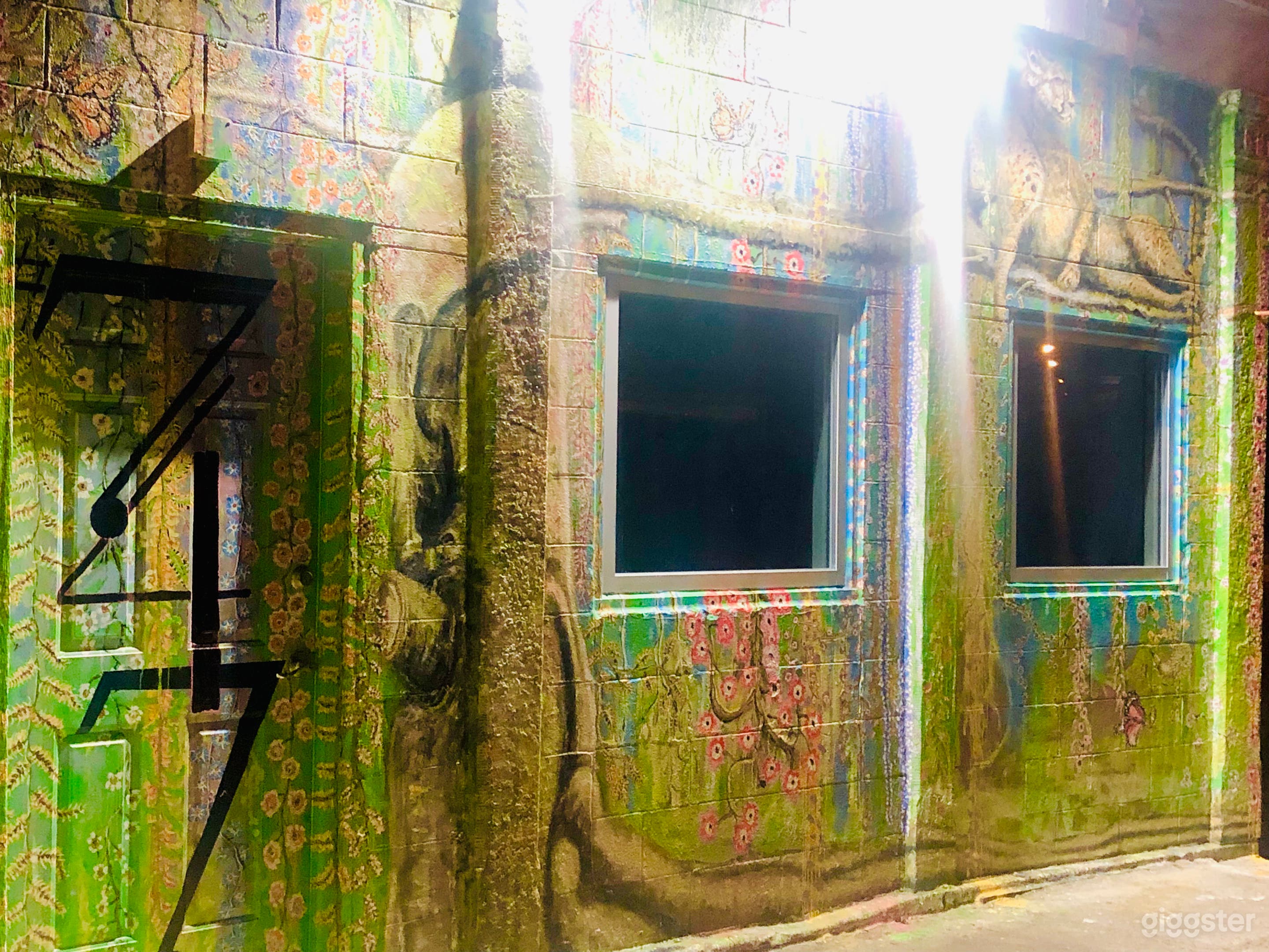 Sophisticated Artist mural, featuring a Big Cat, Monarch Butterflies and Weeping Willows.