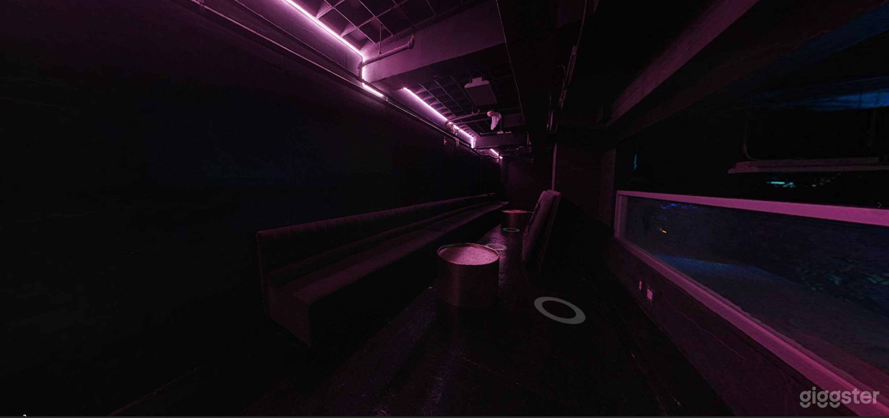 Intimate Speakeasy Cellar with Neon Glow &amp; High-Impact AV Photo 4