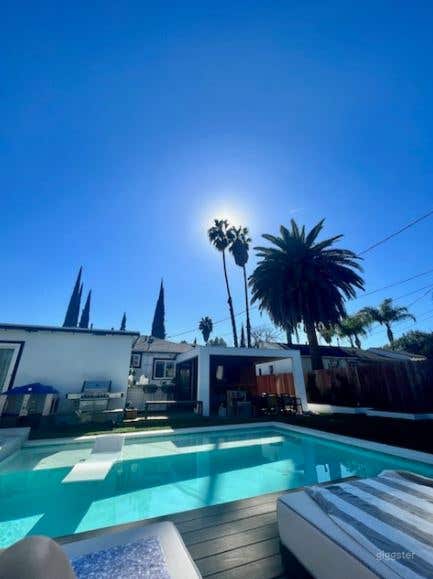 Fabulous Pool Backyard with Jacuzzi and Bar Photo 3
