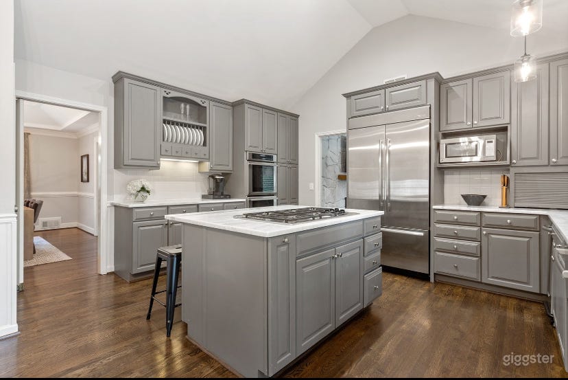 Modern chef’s kitchen with quartz countertops and stainless appliances!