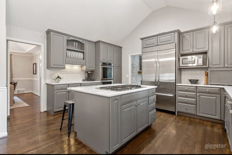  Modern chef’s kitchen with quartz countertops and stainless appliances! 