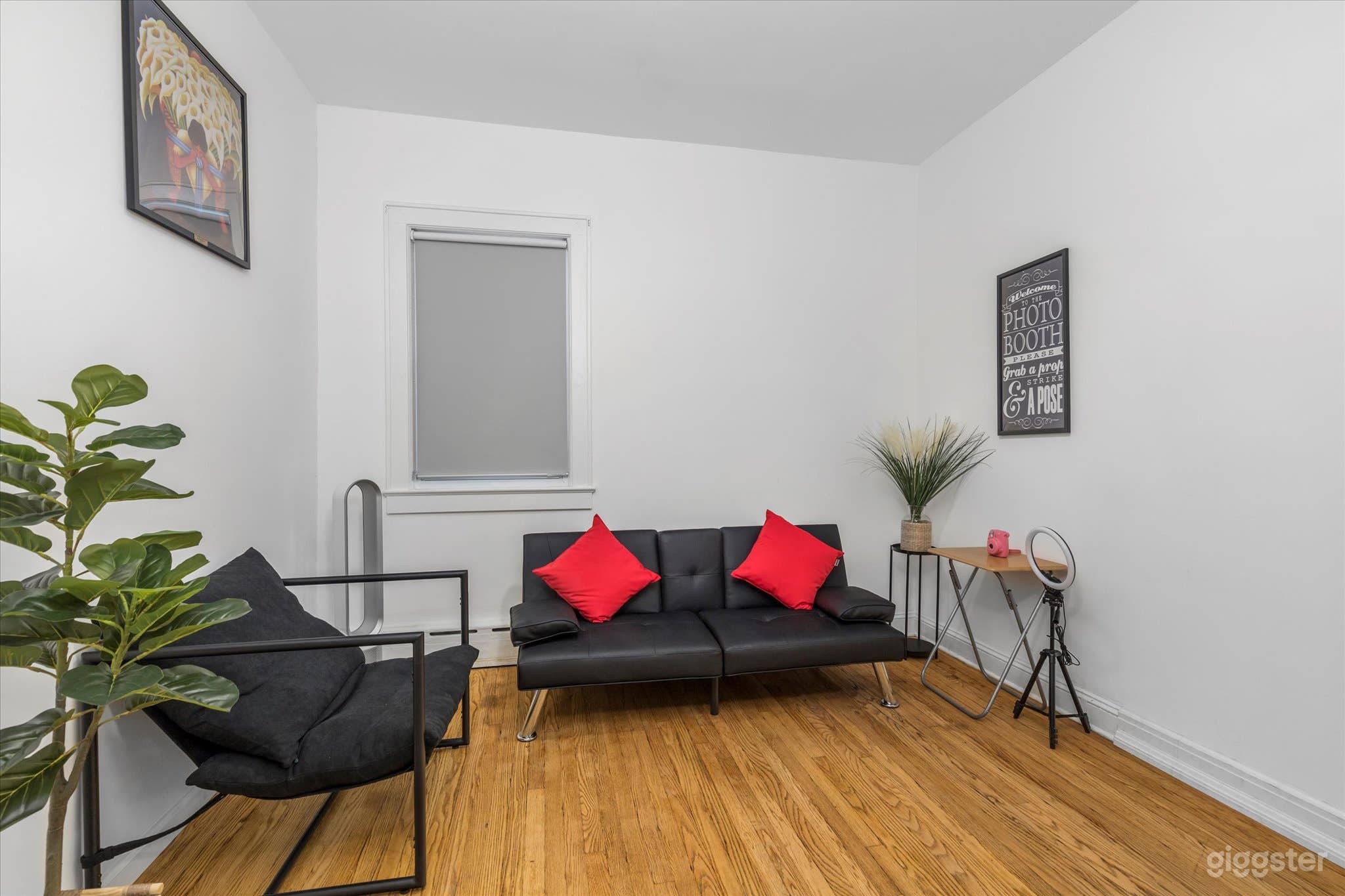 Living room with recently remodeled wooden-styled floors and features one of Diego Rivera's most famous paintings,  "El Vendedor de Alcatraces."