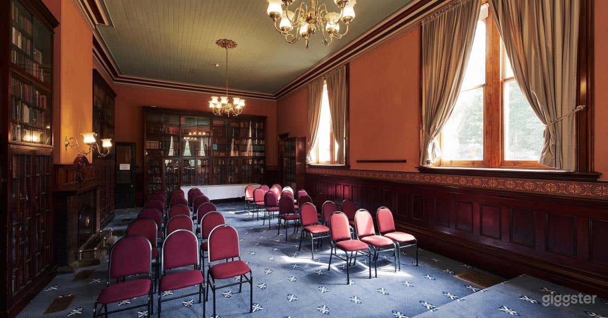 Reading Room with Fireplace and Portraiture View Photo 2