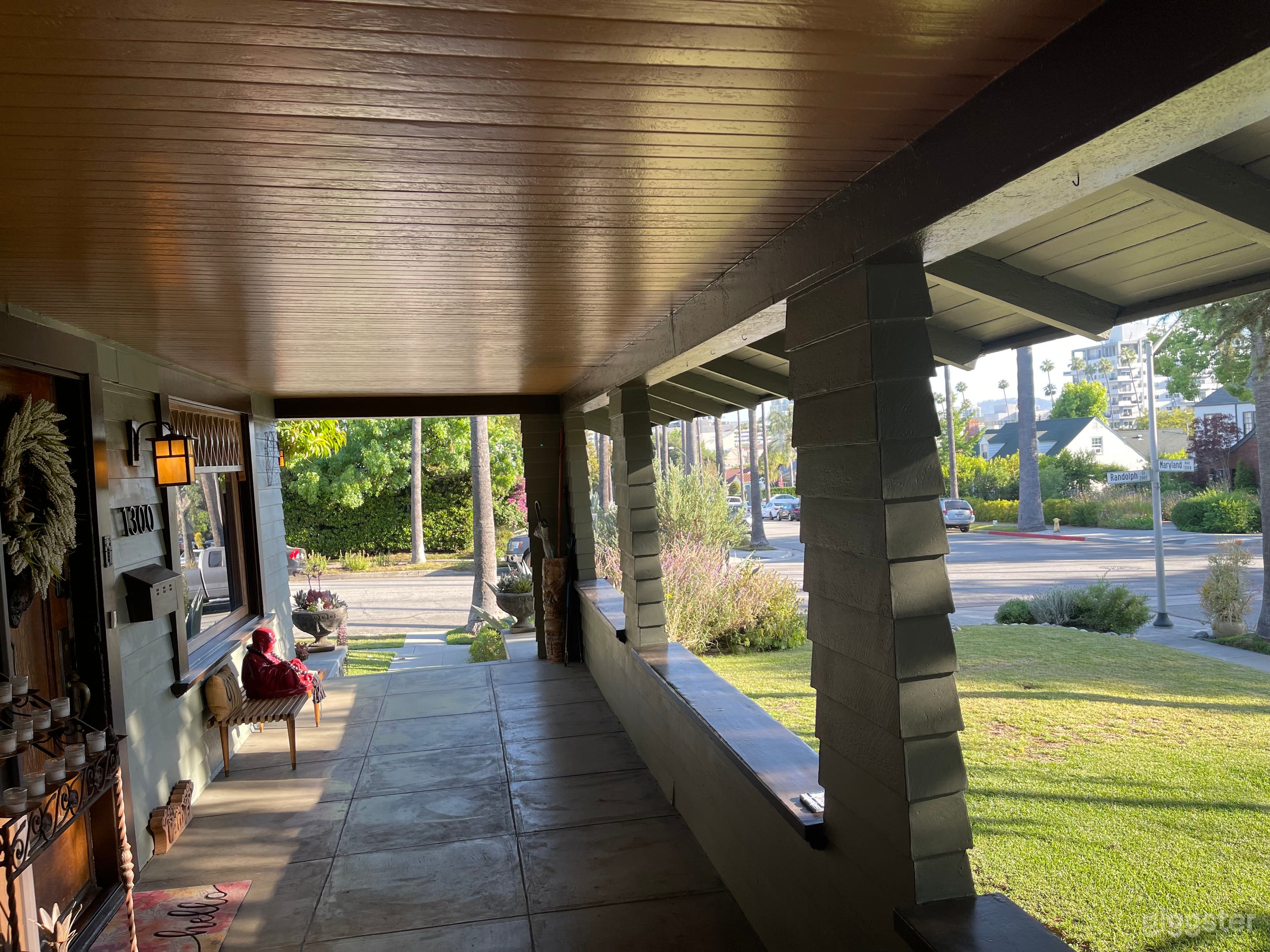 The long, covered front porch with original headboard ceiling offers views of both city and mountains. Neighboring houses include Craftsman, Tudor and Spanish.