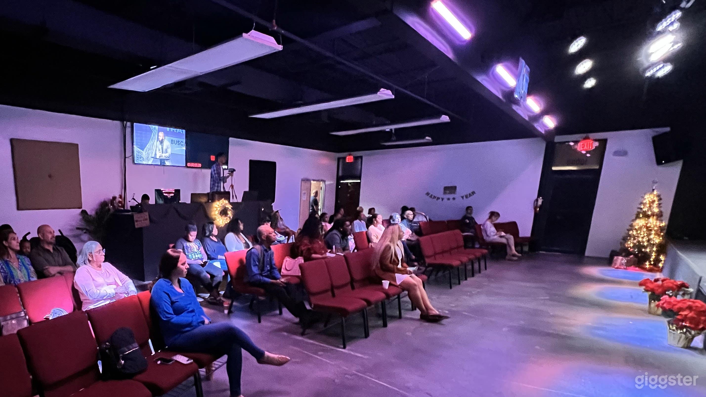 Audience and media booth in the back
