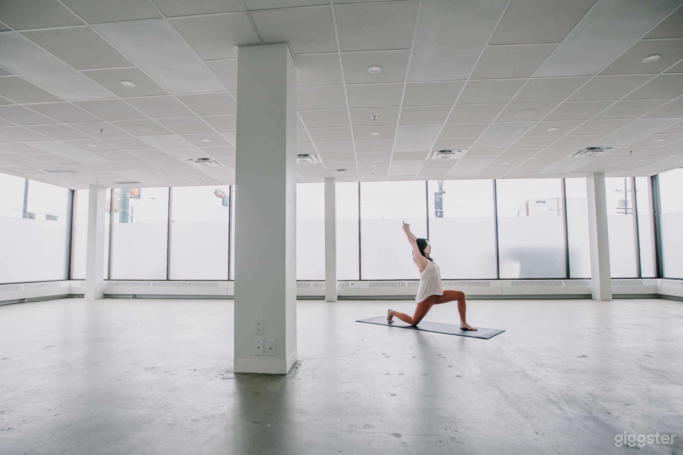 Minimalist Yoga Studio: With its polished floors and serene ambiance, this studio offers a versatile backdrop for yoga-related productions or minimalist-themed shoots.