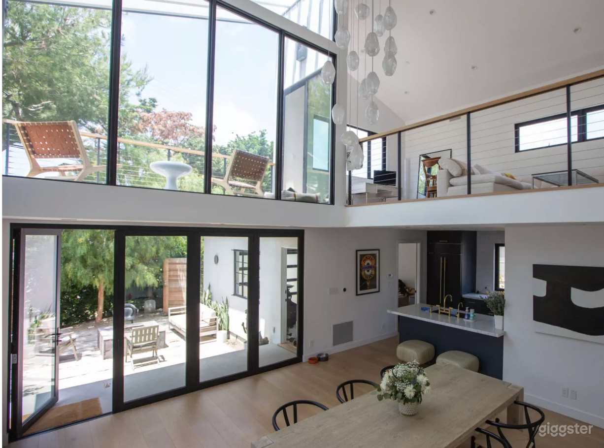 View from the stairs, lots of natural light all day long. The accordion doors open fully to the right.