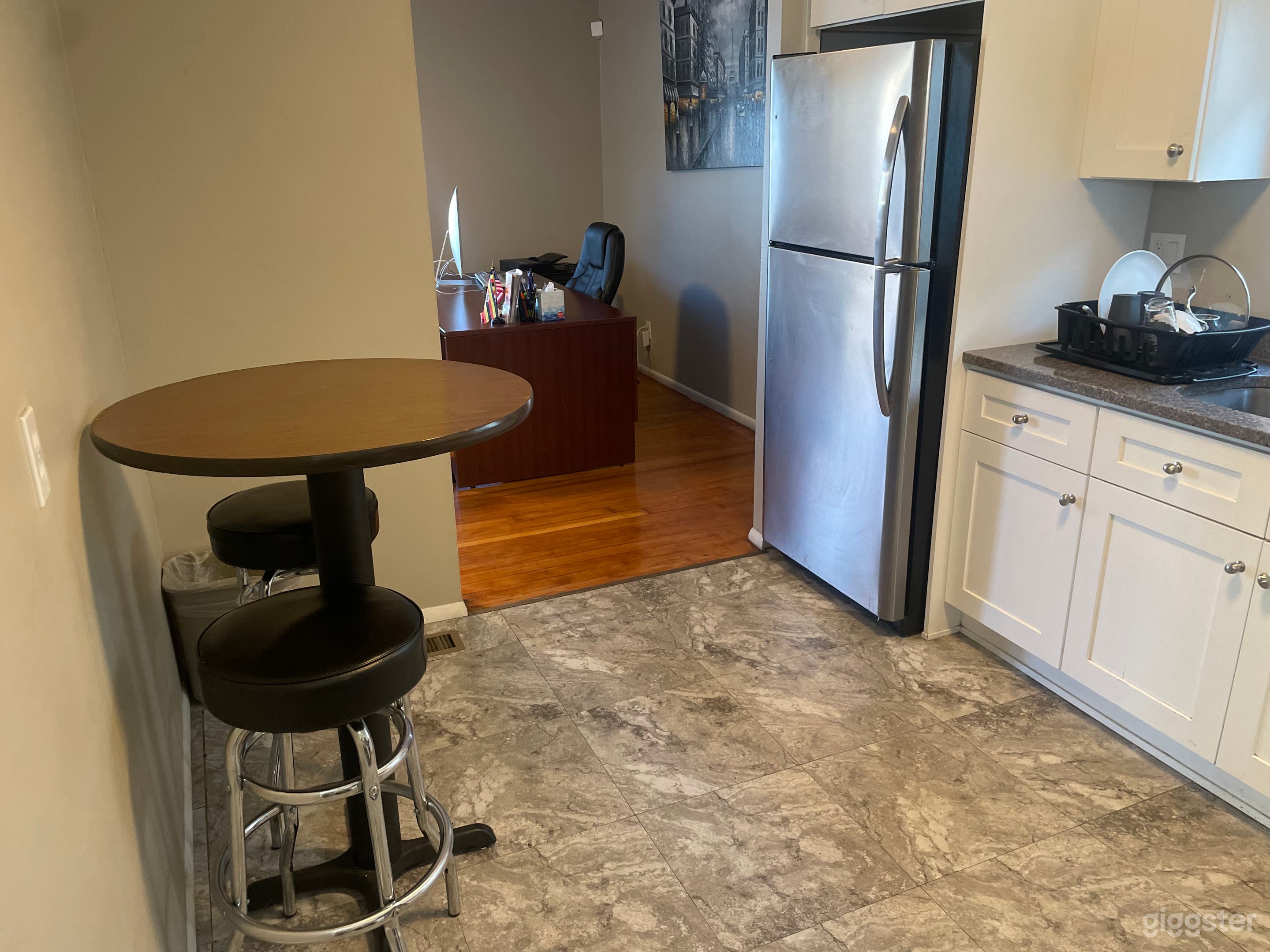 This is the Kitchen area with a full kitchen and bar stolls