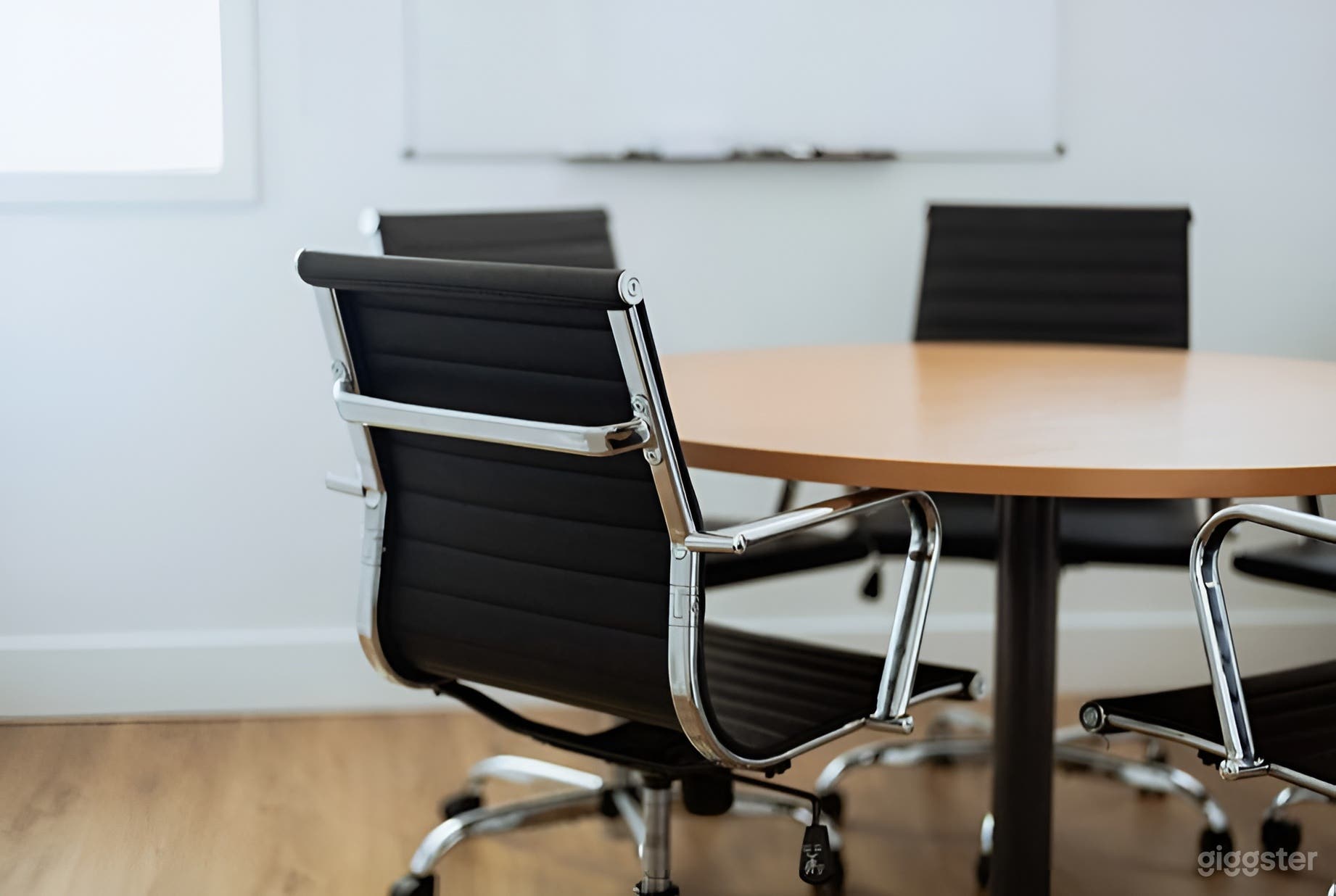 Cozy Conference Room with Whiteboard and Projector Photo 3