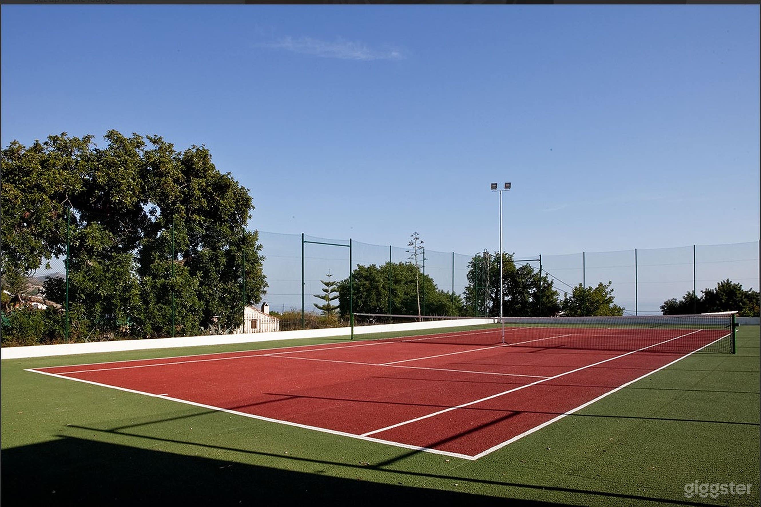Versatile And Picturesque Tennis Court Photo 1