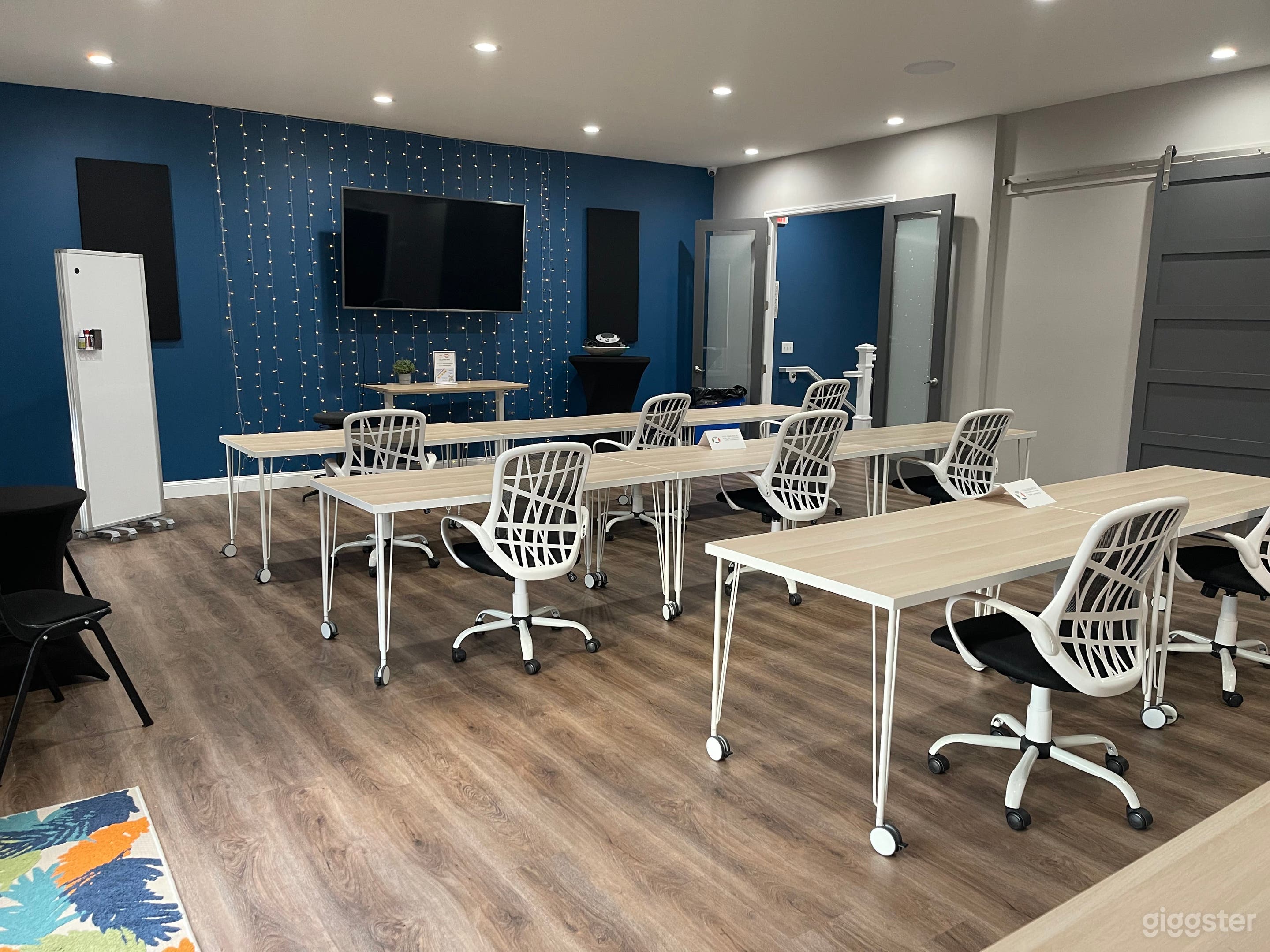 Furnished with tables and chairs, mobile white board for a variety of events, from classes, seminars or informal gatherings.