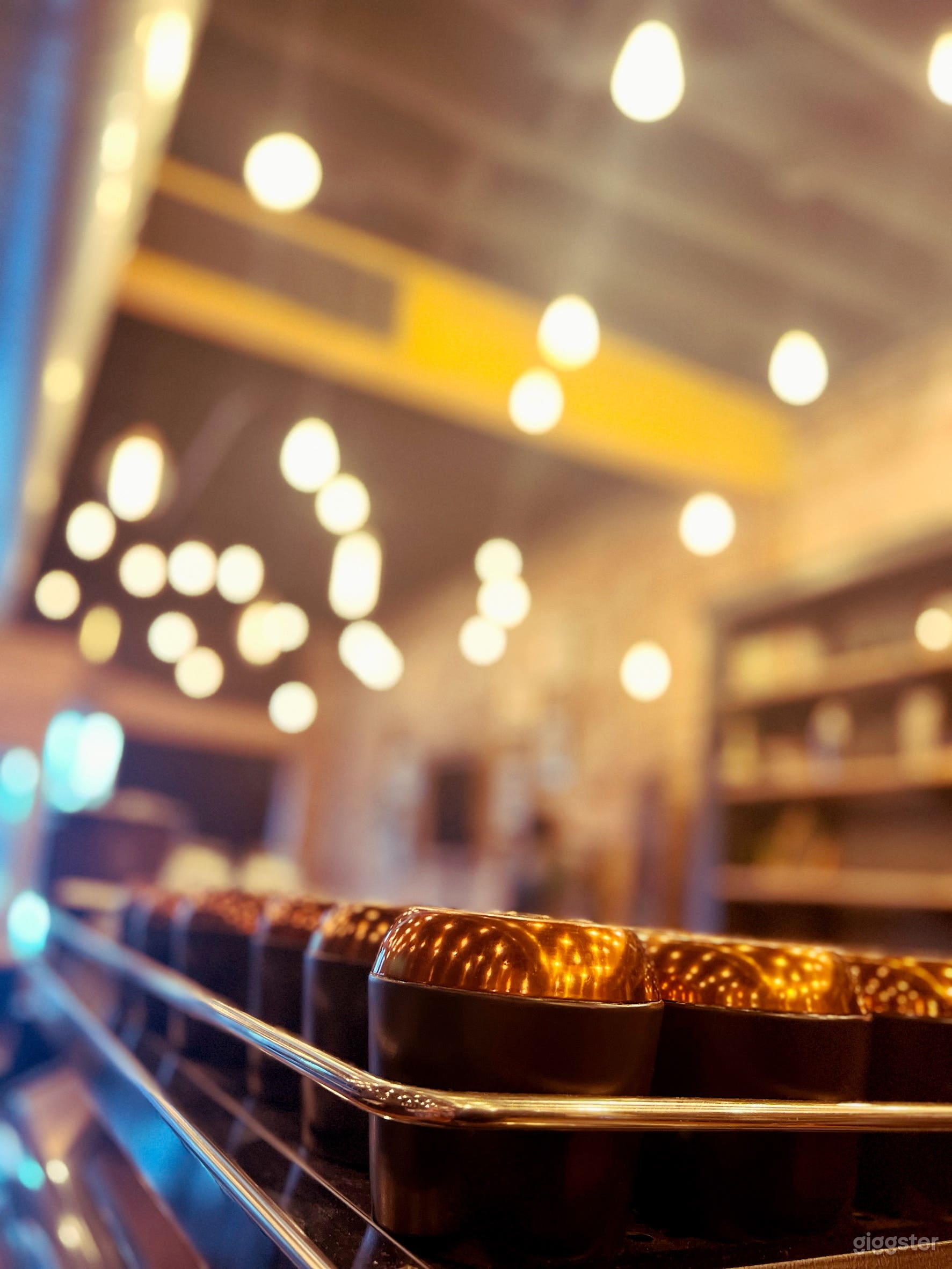 Cozy/Ambient coffee shop, warm lighting, brick interior Photo 2