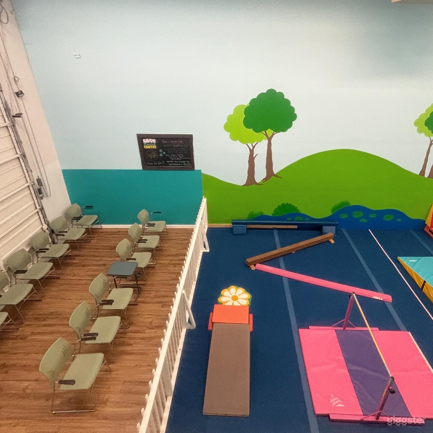 viewing area/fence/into gymnastics space. 